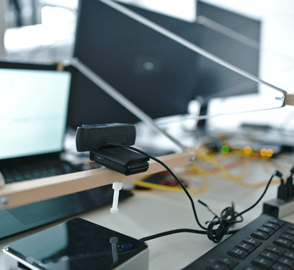 Rig holding a camera pointed at a screen